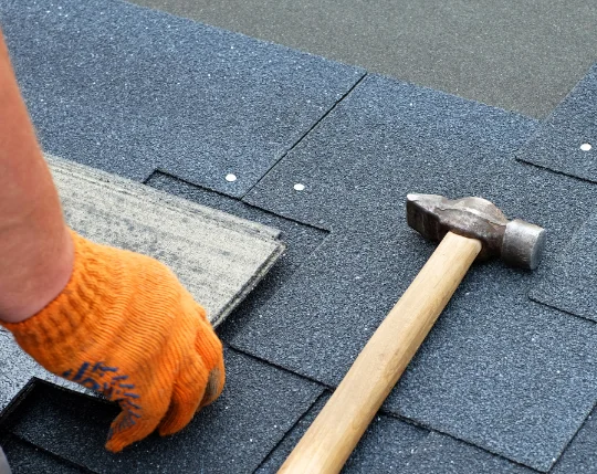 Cracked and missing shingles on a Central Florida roof